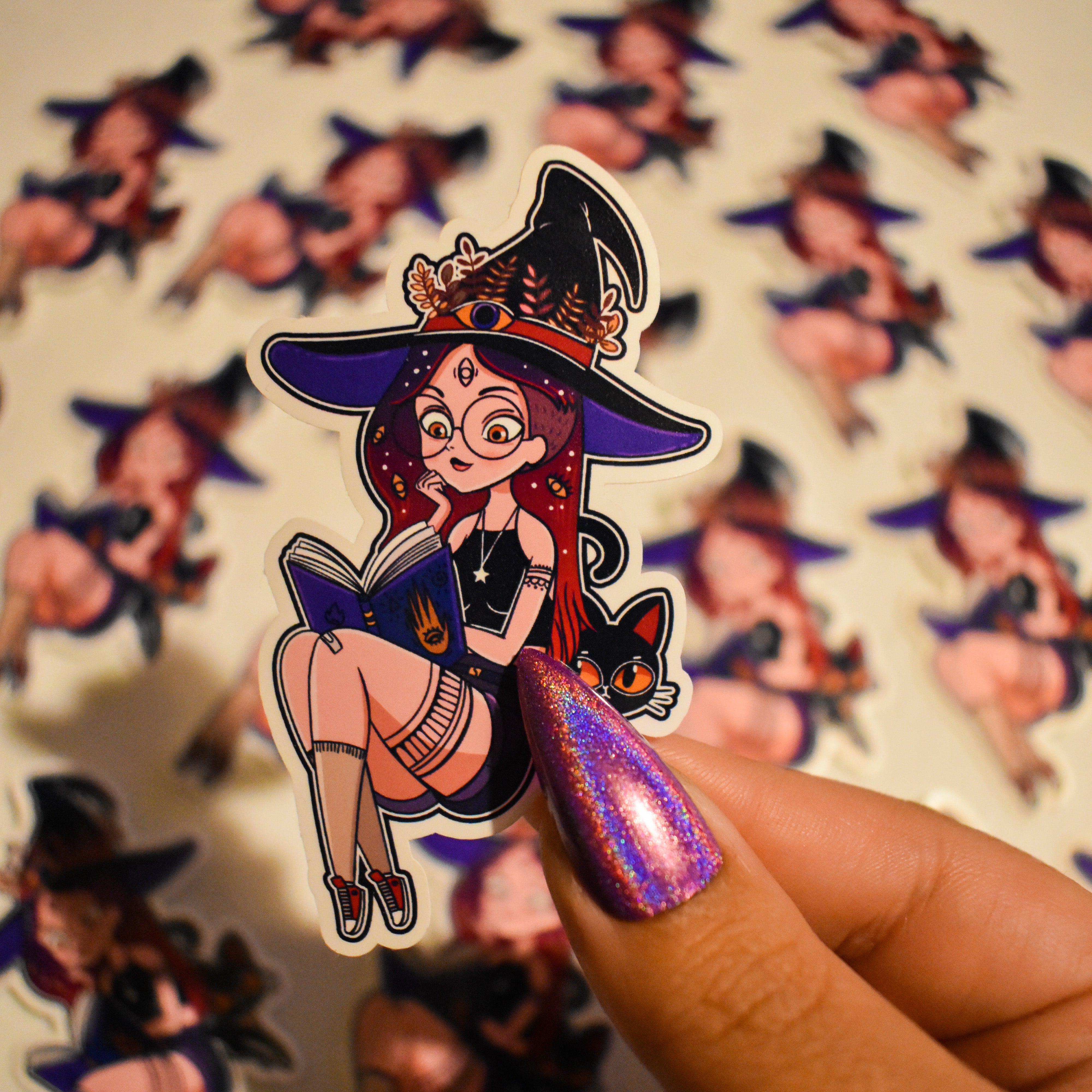witch reading her magic book with her familiar sticker