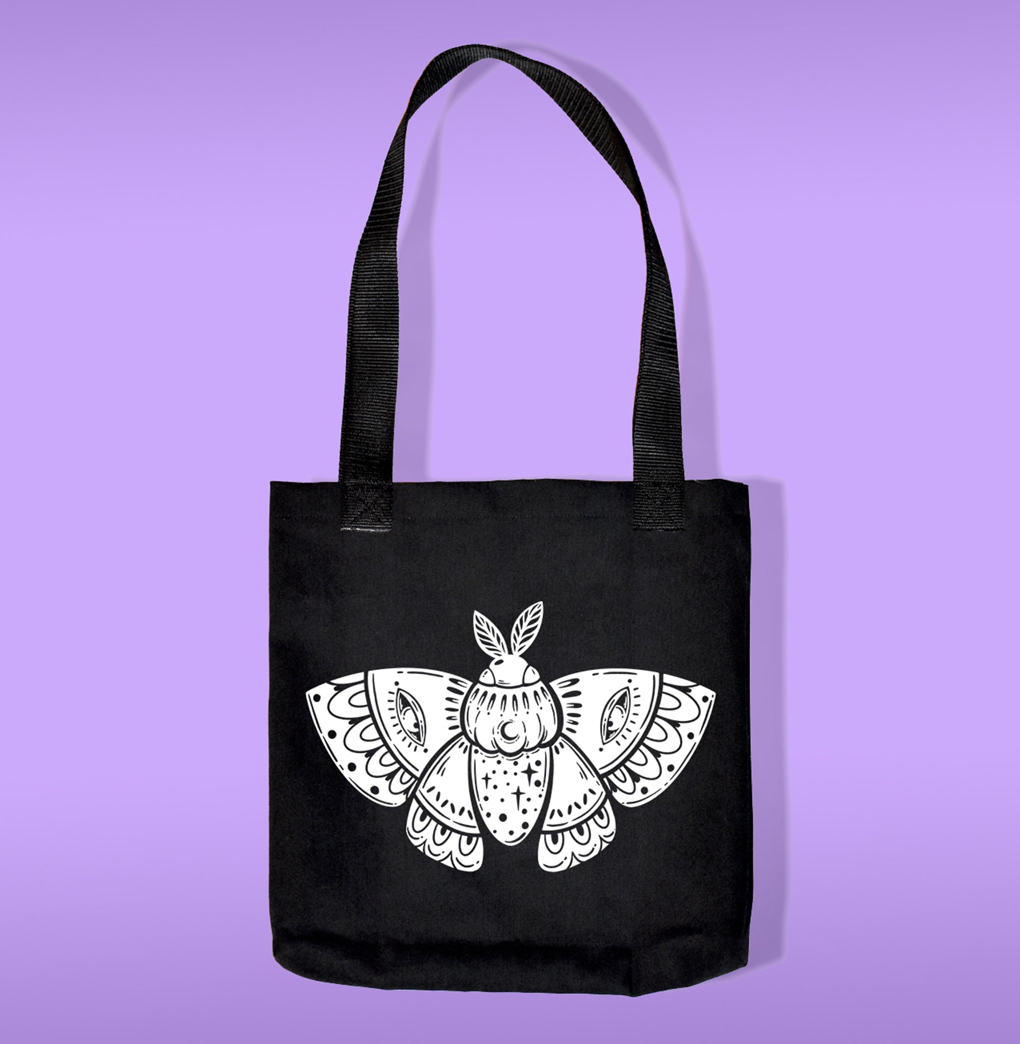 A black canvas bag with polypropelene straps. Features a moth heat transfer print