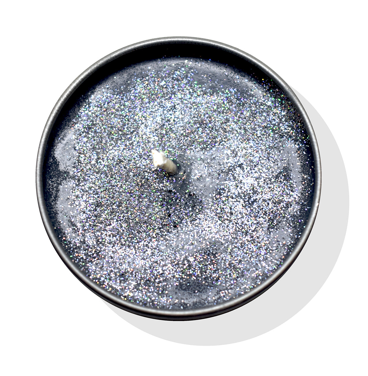 top view of candle which shows it;s a black candle with super fine eco glitter at the top